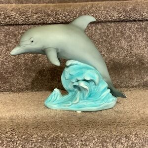 Dolphin riding a wave